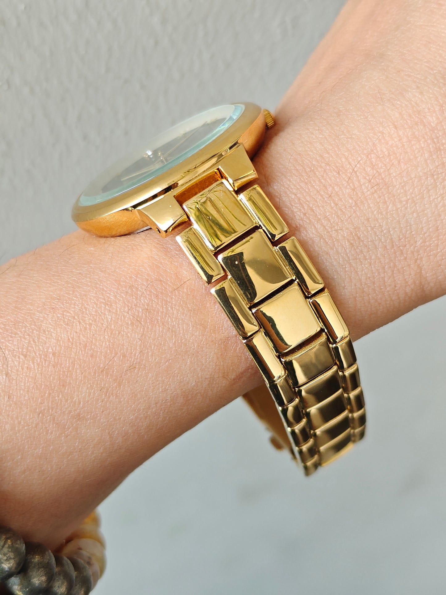 Bestseller gold watch with green sunray dial