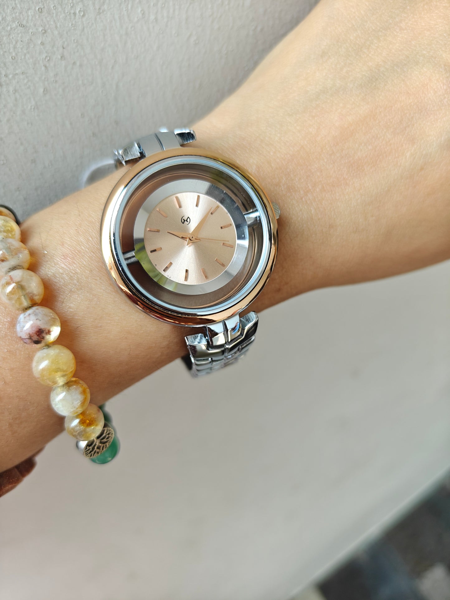 Designer and heavy look Steel watch with rosegold rim and transparent outer ring