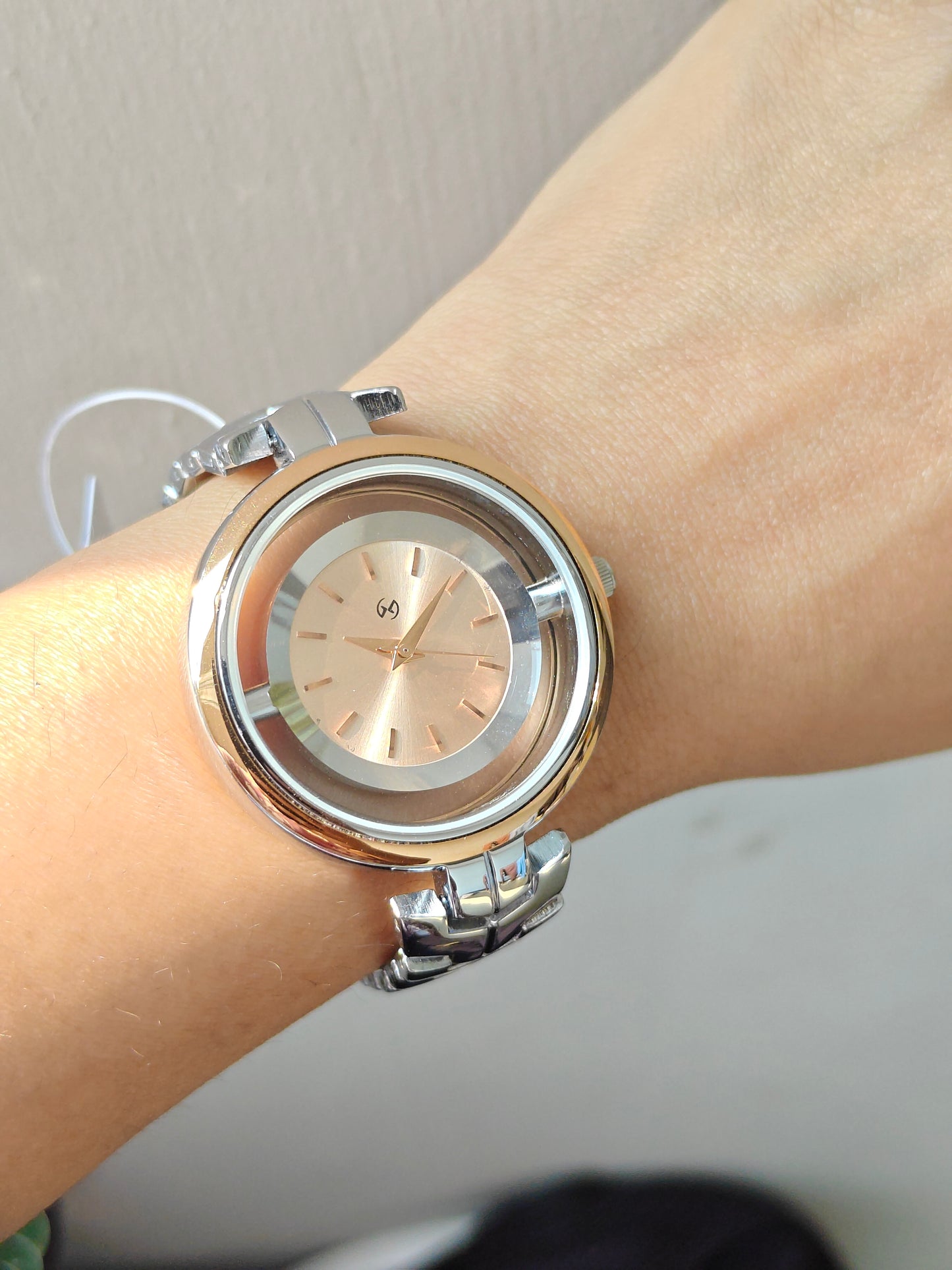 Designer and heavy look Steel watch with rosegold rim and transparent outer ring