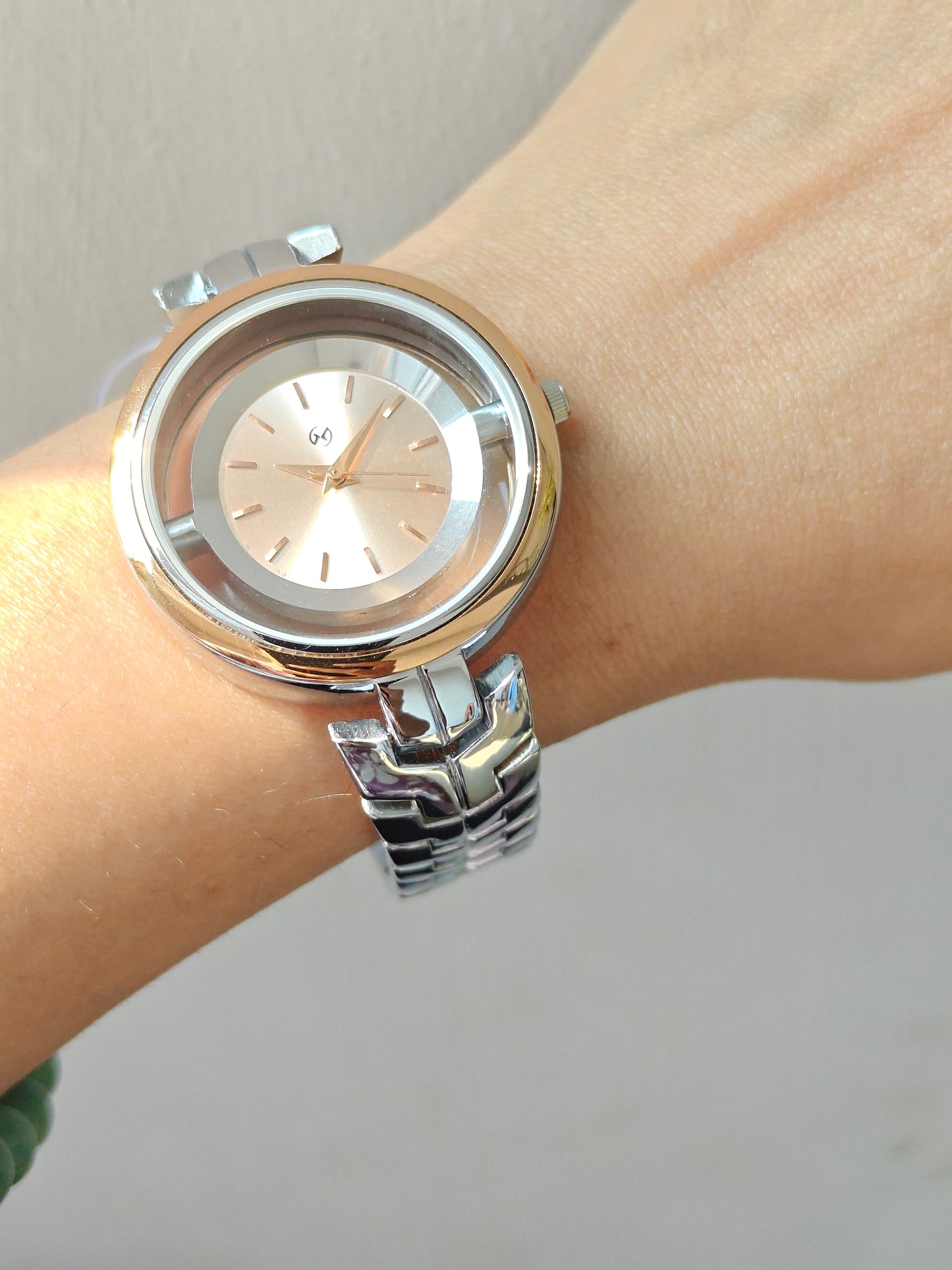 Designer and heavy look Steel watch with rosegold rim and transparent outer ring