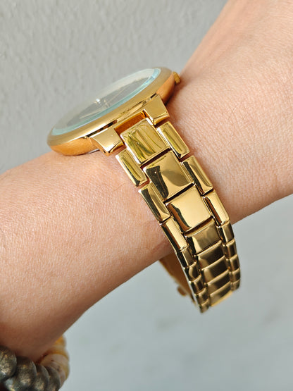 Bestseller gold watch with green sunray dial