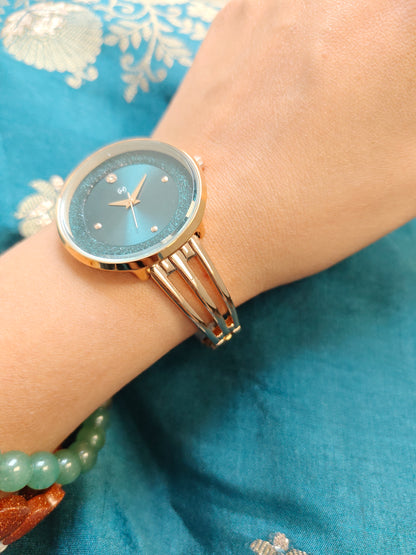 Modern yet traditional bangle style green dial watch with sparkling dial