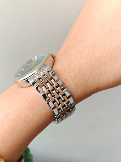 Modern european style green dial watch with embossed dial details in two tone chain