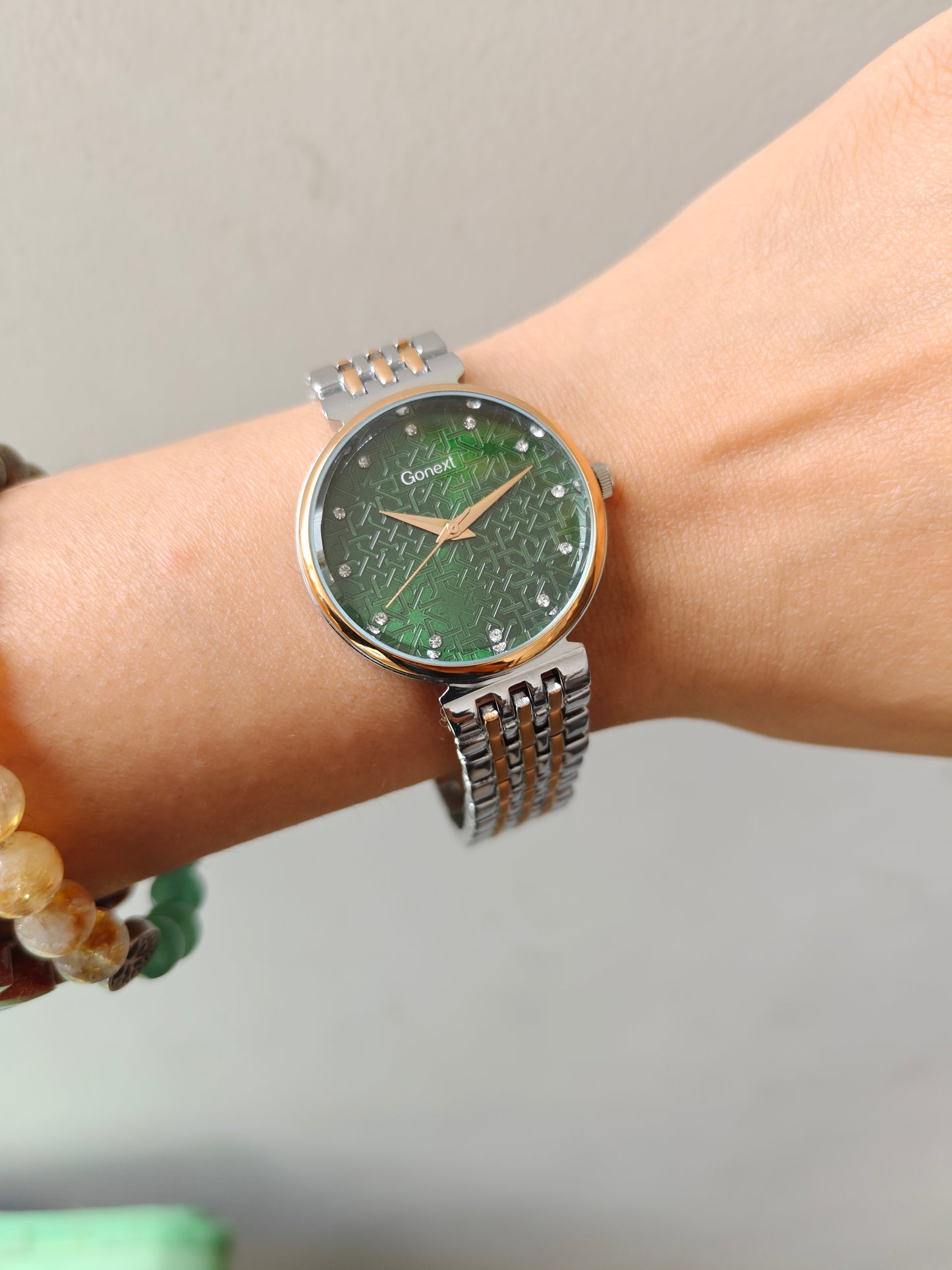Modern european style green dial watch with embossed dial details in two tone chain