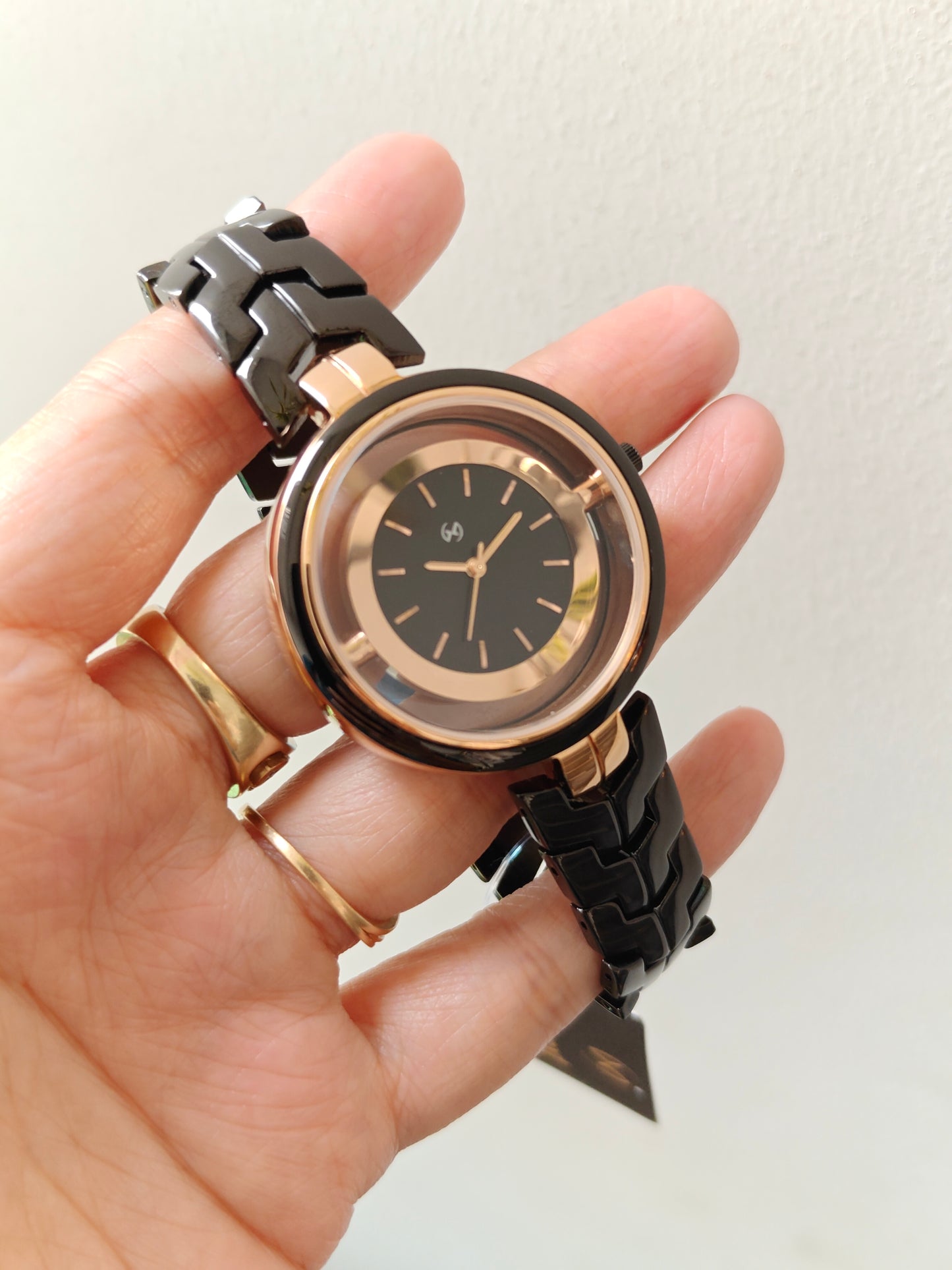 Designer and heavy look balck rose gold watch with transparent outer ring