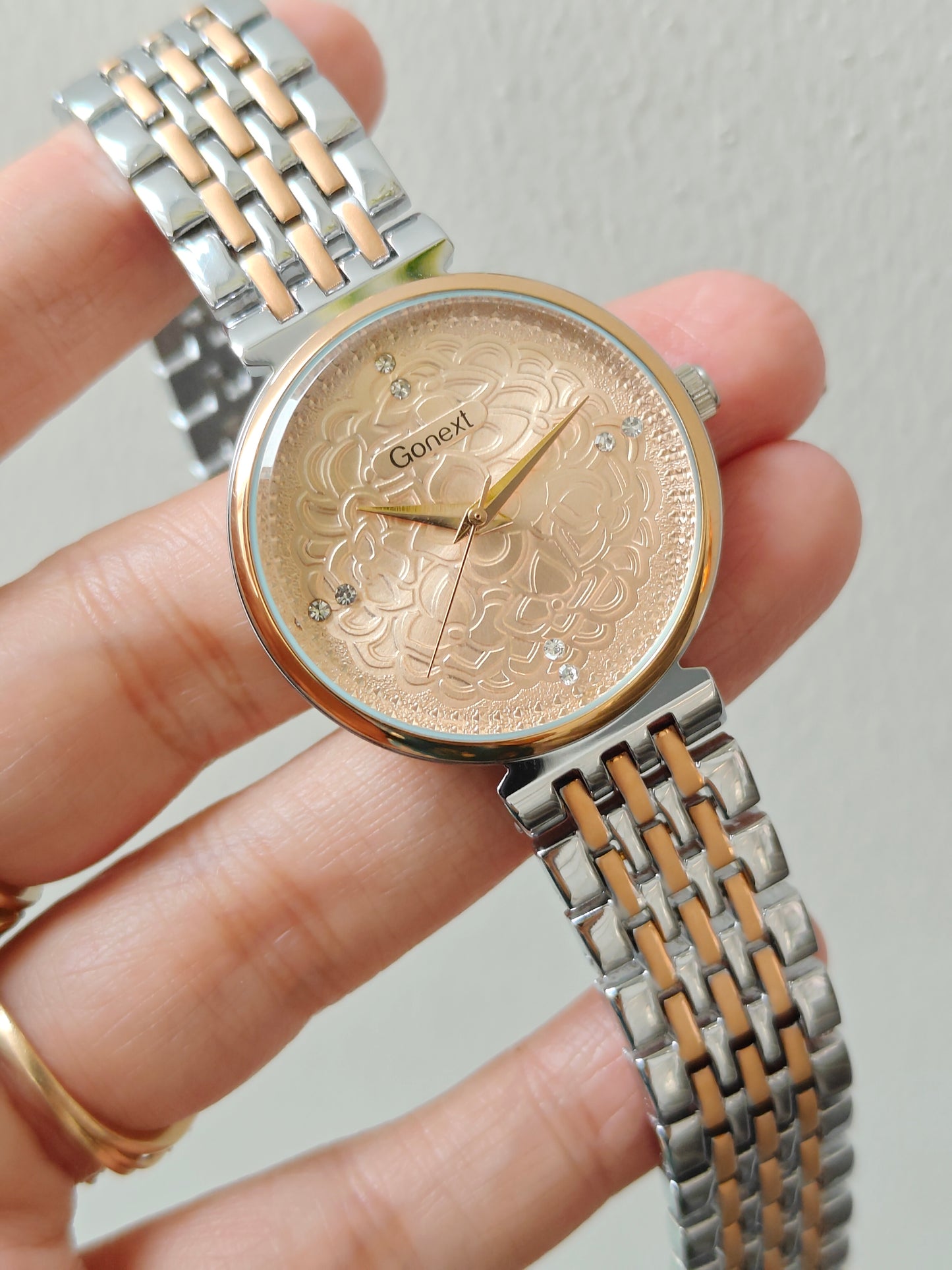 Modern european style watch with embossed dial details in two tone chain
