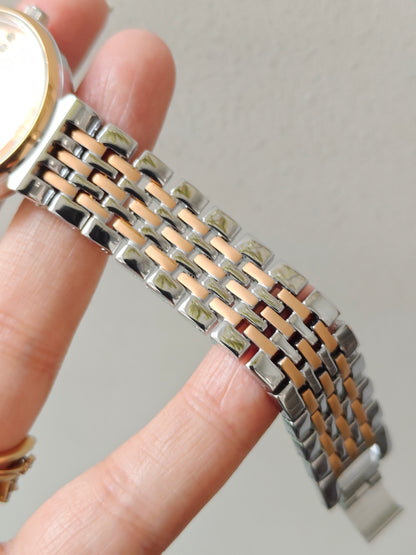Modern european style watch with embossed dial details in two tone chain