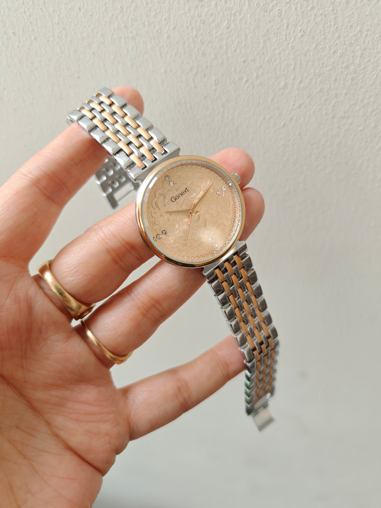Modern european style watch with embossed dial details in two tone chain