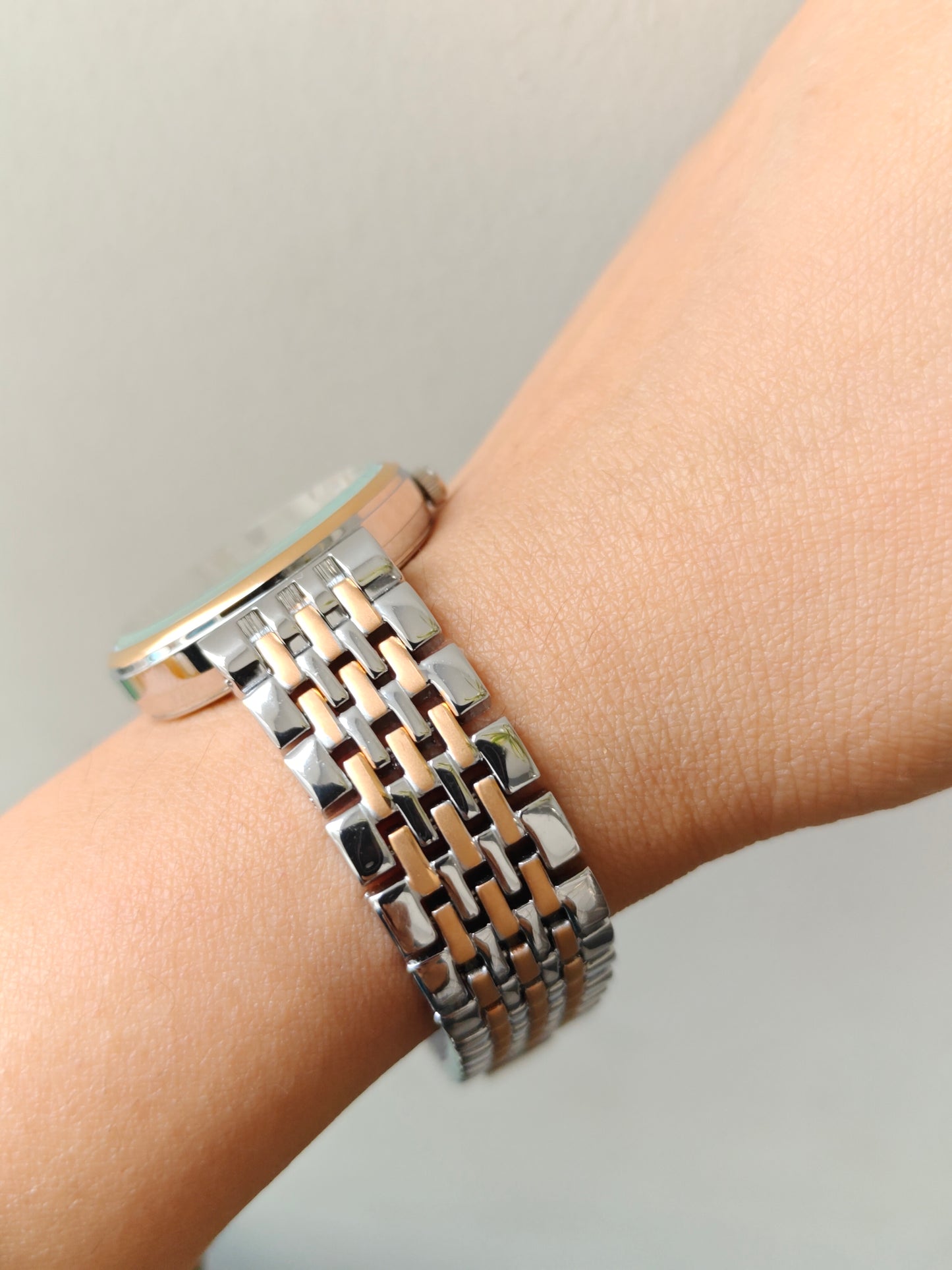 Modern european style watch with embossed dial details in two tone chain