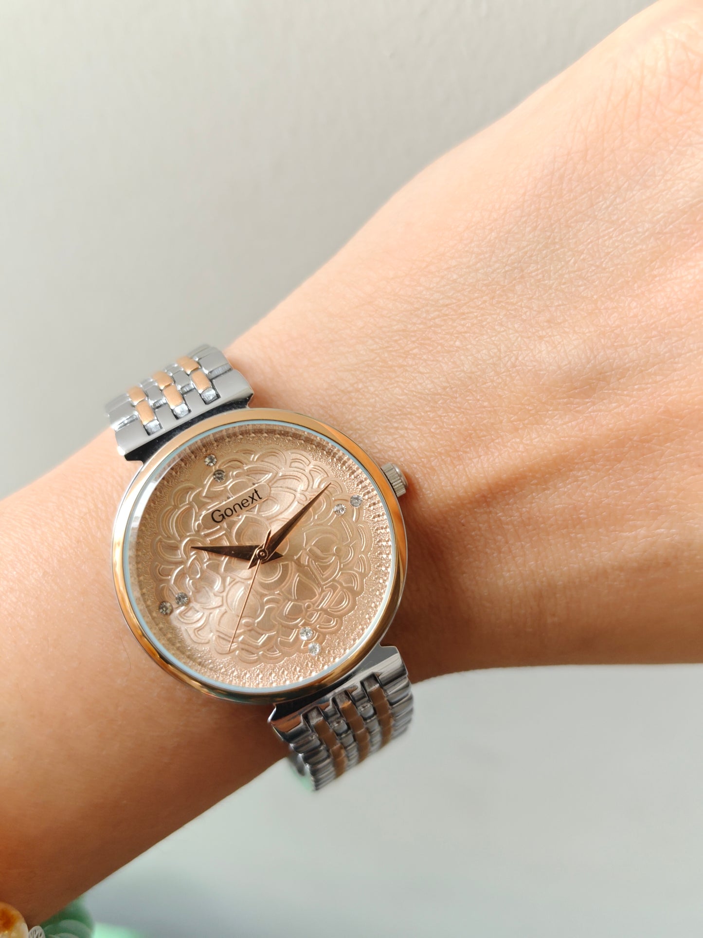 Modern european style watch with embossed dial details in two tone chain