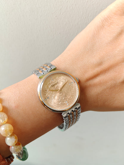 Modern european style watch with embossed dial details in two tone chain