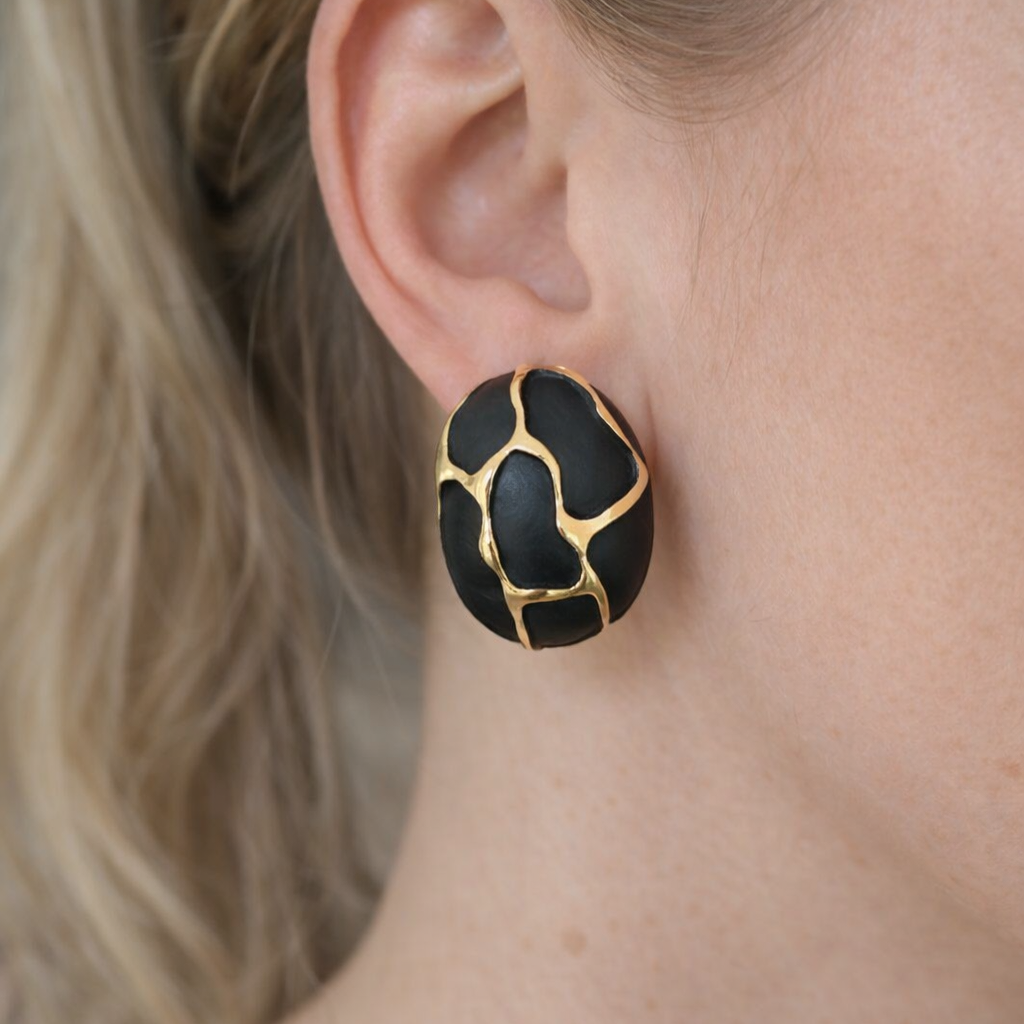 Statement oval earrings with black finish and gold plating durable and long lasting
