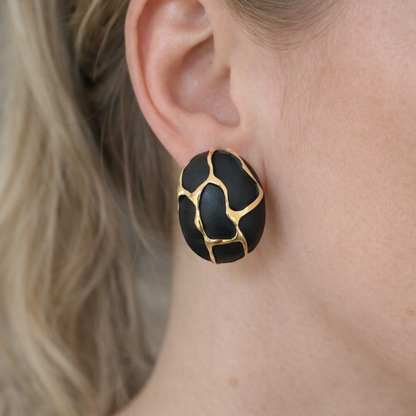 Statement oval earrings with black finish and gold plating durable and long lasting