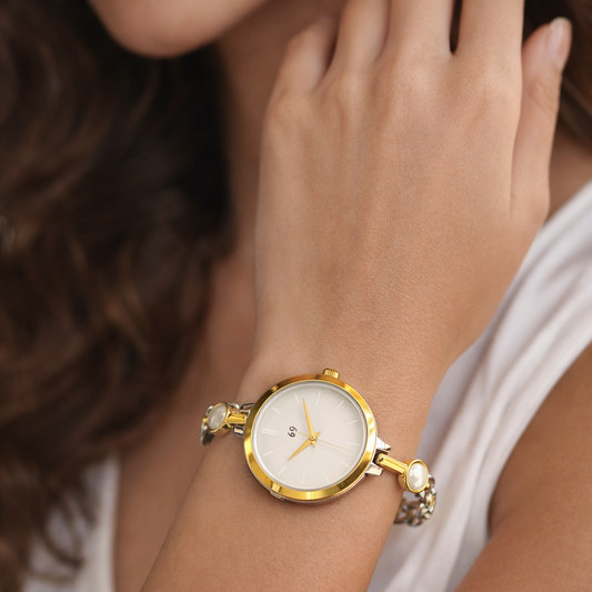 Designer gold watch with unique chain in shiny pearl with steel touch