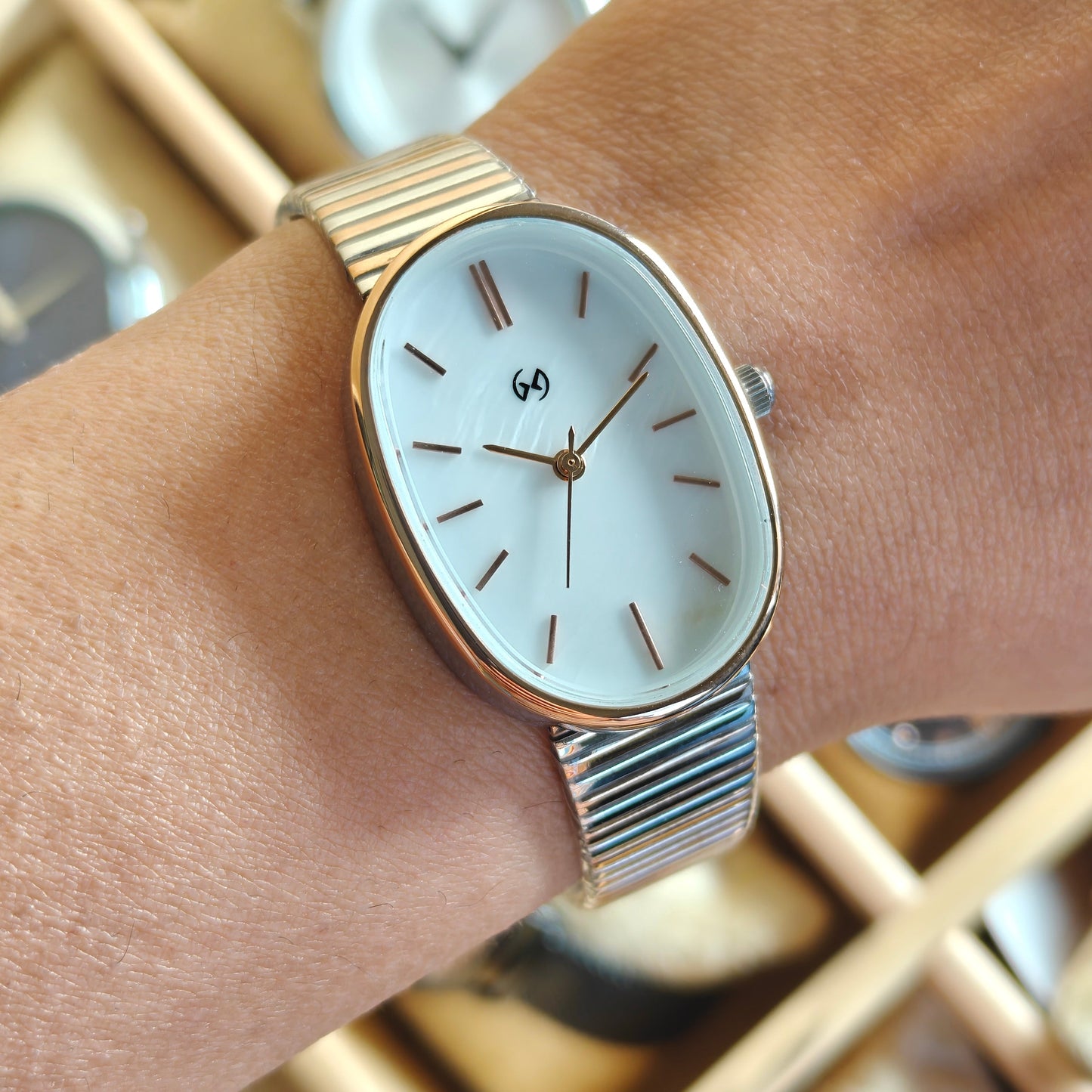 Modern style oval watch with white MOP dial and soft two tone chain self adjustable watch