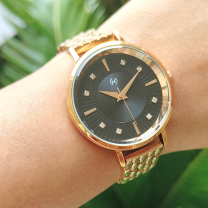 Rose gold watch with black embellished and textured dial featuring European style chain for women