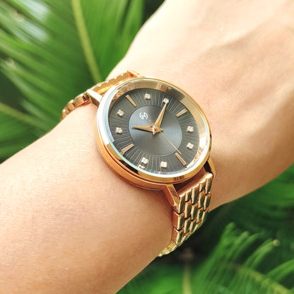 Rose gold watch with black embellished and textured dial featuring European style chain for women