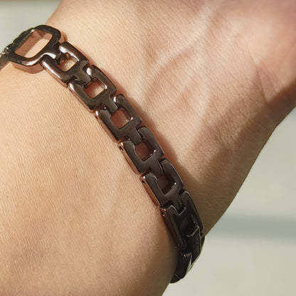 Unique brown watch with dark maroon dial in square case